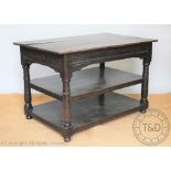 An 18th century and later oak three tier table, with side drawer, on turned legs,