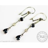 A pair of diamond and untested sapphire set drop earrings,