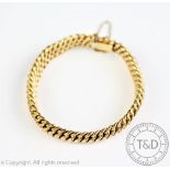 A 9ct gold bracelet, Birmingham 1973, of fancy link uniform form with integral clasp,