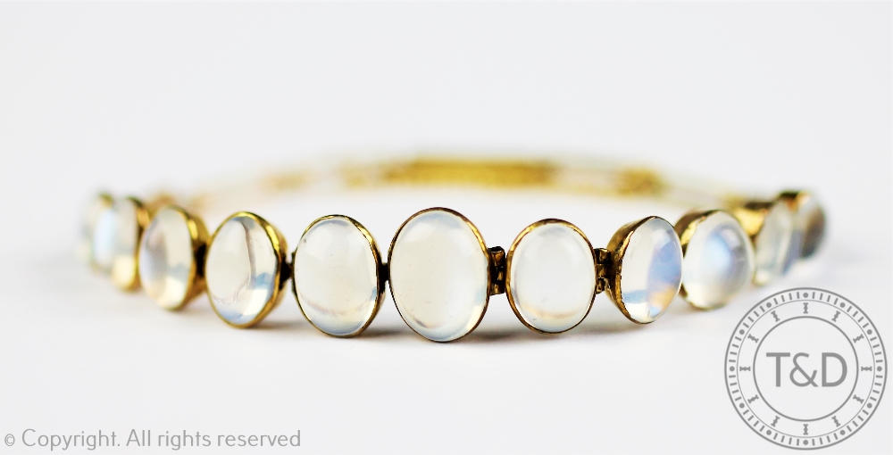 A moonstone set bracelet, designed as eleven graduated moonstones,