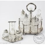 An Aesthetic silver plated four piece cruet set, with cut glass condiments, 12.