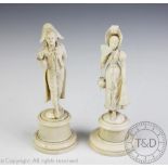 A pair of Victorian carved ivory figures,