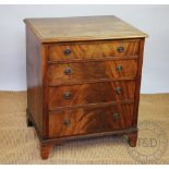 A George III style mahogany chest of small proportions, with four graduated long drawers,