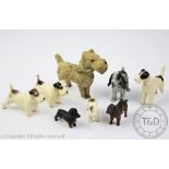 Four cold painted spelter Austrian type terrier dogs, each modelled standing, largest 6cm high,