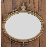 A later 19th century Adam revival gilt wood and gesso oval mirror,
