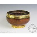 A brass mounted turned wood bowl c1900, with raised foot (rim loose), 23.