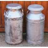 Two vintage milk churns and covers,
