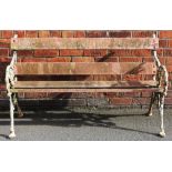A Coalbrookdale style cast iron garden bench, with slatted back and seat,