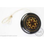 A late 19th century Tunbridge Ware Macassar ebony yo-yo in the manner of Thomas Barton,