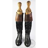 A pair of gentleman's black and tan leather hunting boots,