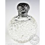 A Victorian silver topped cut glass scent bottle, London 1890, of large proportions,