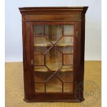 A George III style mahogany corner cabinet, with astragal glazed door,