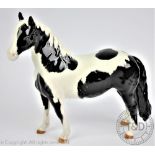 A Beswick Pinto pony, model number 1373, designed by Arthur Gredington, piebald gloss, 16.