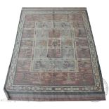 A Kilim type rug, worked with a panel of geometric animals and flowers,