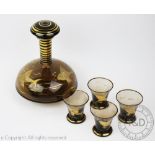 A 20th century novelty glass liqueur set comprising; a decanter and stopper,