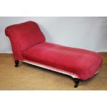 A late Victorian pink upholstered chaise longue, on turned legs 153cm long,