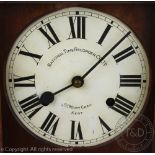A National Time Recorder wall clock, oak cased and with pendulum and key,