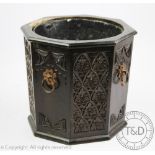 An early 20th century stained oak jardiniere / coal bin, with zinc liner,