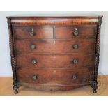 A William IV carved mahogany bow front chest,