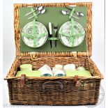 A vintage 1970's wicker picnic hamper, with complete interior to include two thermos flasks,