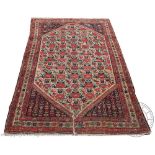 A Persian hand woven wool rug,