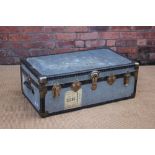A vintage travel trunk, with metal mounted corners and straps,