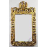 A George III style gilt wood and gesso wall mirror,