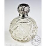 An Edwardian silver topped cut glass scent bottle and stopper, Chester 1907, 13.