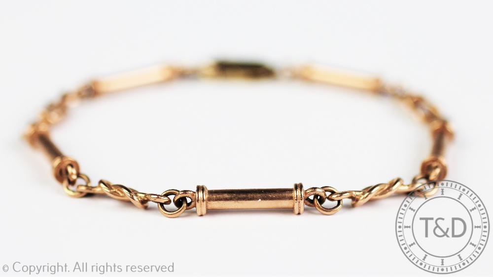 A 9ct rose gold decorative link bracelet, designed as bar and knotted links,