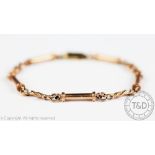 A 9ct rose gold decorative link bracelet, designed as bar and knotted links,
