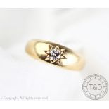 A diamond set ring, the old brilliant cut diamond gypsy set in 18ct yellow gold, weight 4.