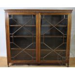 An Edwardian walnut display cabinet, with label verso for 'Spillman & Co London',