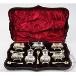 A complete and cased Victorian silver condiment set, James Deakin & Sons, Chester 1894,