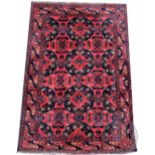 A Caucasian hand woven wool rug,