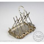 Golfing interest; An early 20th century silver plated novelty toast rack,