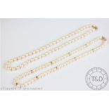 A single strand uniform cultured pearl necklace, with attached 9ct yellow clasp,