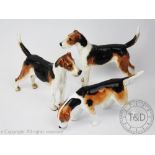 Two Royal Doulton Foxhounds, HN1026, each modelled standing,