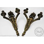 A pair of early 20th century gilt wood and gesso wall sconces,