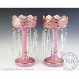 A pair of late Victorian pink opaline glass lustres,