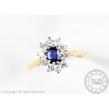 An untested sapphire and diamond cluster ring,