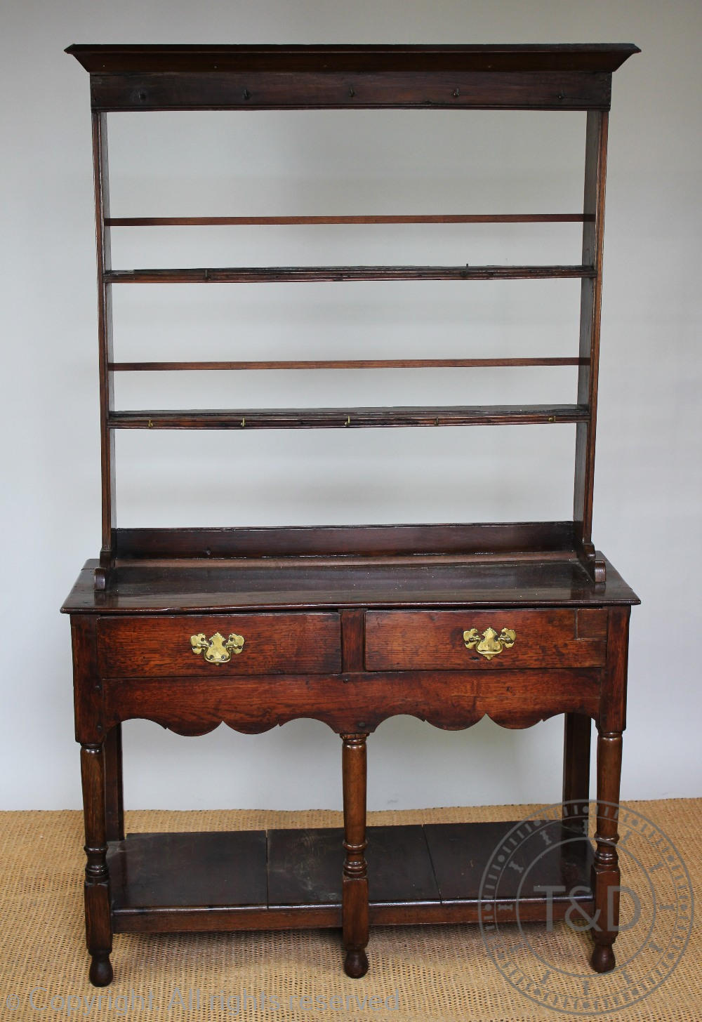 A George III style oak dresser of small proportions,