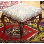 A Victorian carved rosewood stool, with upholstered top, on cabriole legs,