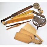A collection of 19th century and later treen to include two butter pats, a flour scoop,