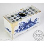 A 18th century blue and white delft flower brick,