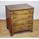 A George III style mahogany chest of small proportions, with four graduated long drawers,