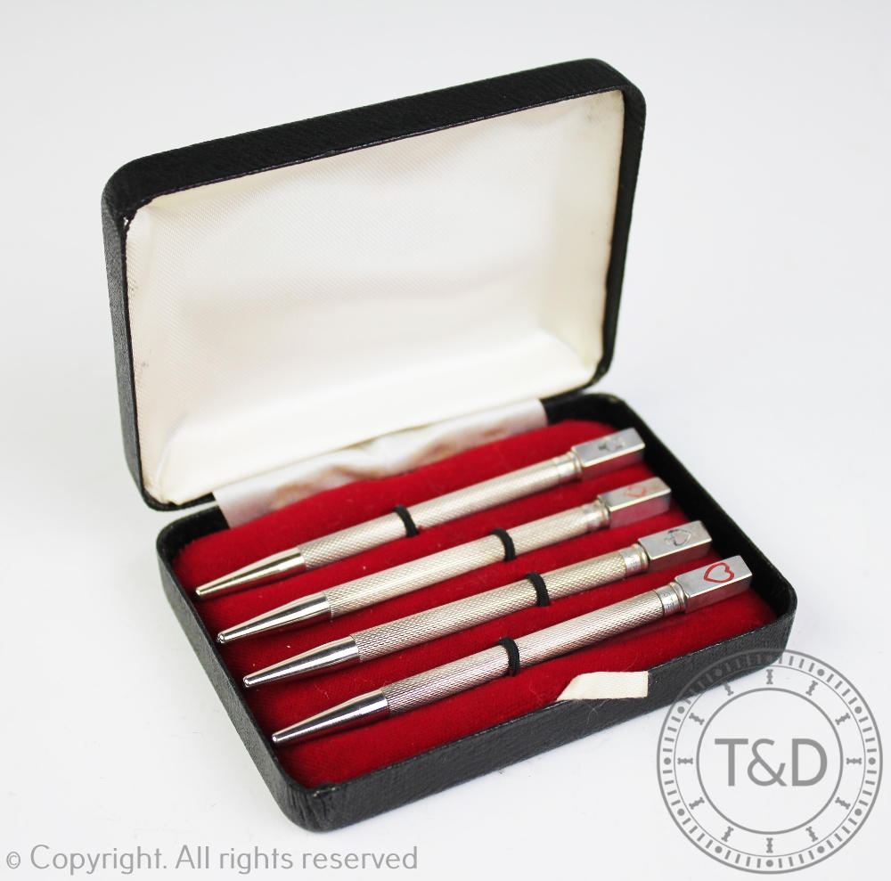 A cased set of four sterling silver Bridge pencils,