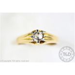 A diamond set ring, the single old brilliant cut diamond within gypsy type claw setting,