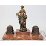 A late 19th century figural bronze and marble inkwell,