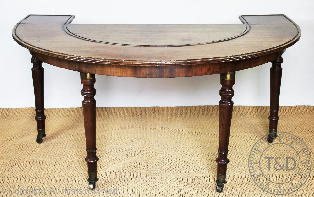 An early 19th century mahogany hunt table,