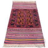 Two Kilim type wood rugs, decorated with geometric motifs,